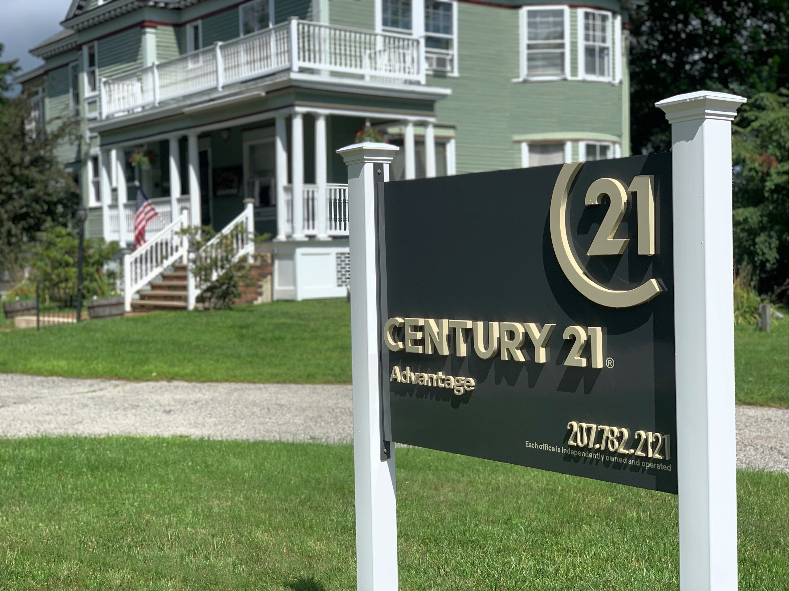 CENTURY 21 Lewiston, ME Exterior office sign in front of the historical office building
